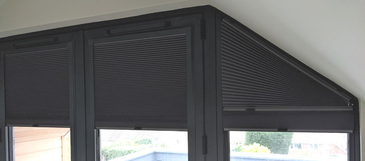 Shaped Duette blinds in bedroom